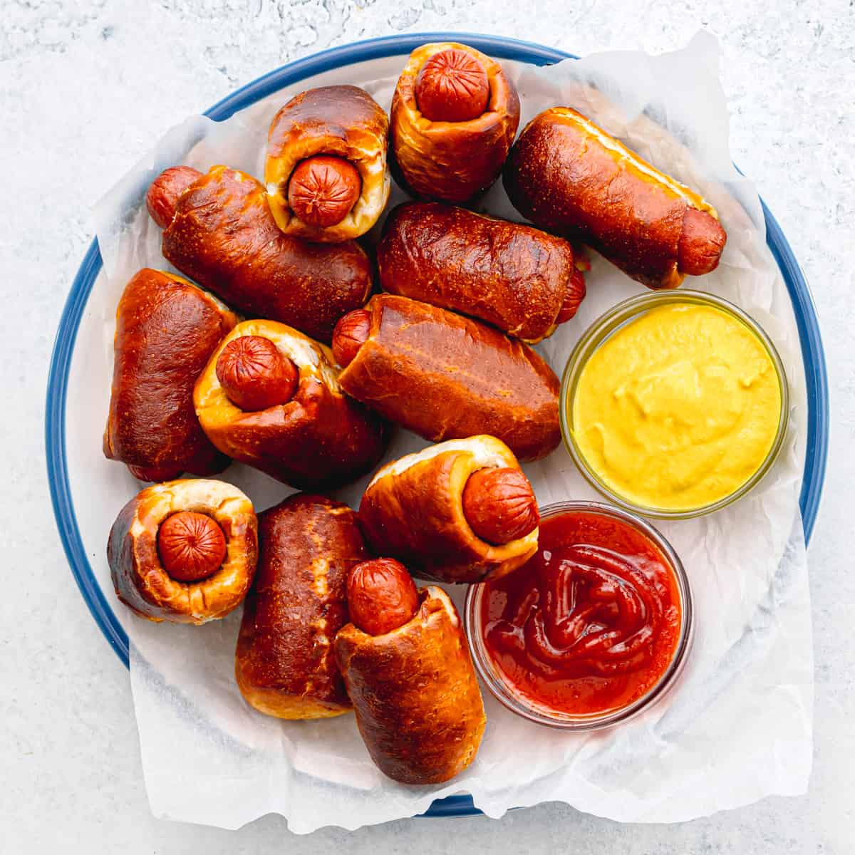 Mini Pretzel Dogs with ketchup and yellow mustard. 